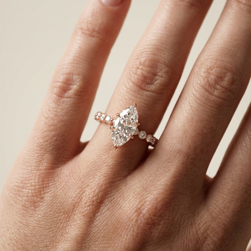 Marquise Cut Lab Grown Diamond Engagement Ring with floating side stones set in Rose Gold