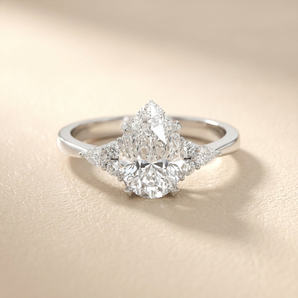 Pear Cut Lab Grown Diamond Three Stone Engagement Ring in Platinum