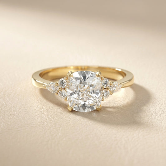 Cushion Cut Lab Grown Diamond Three Stone Engagement Ring in Yellow Gold