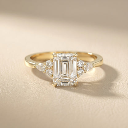 Emerald Cut Lab Grown Diamond Engagement Ring with side stone clusters set in Yellow Gold