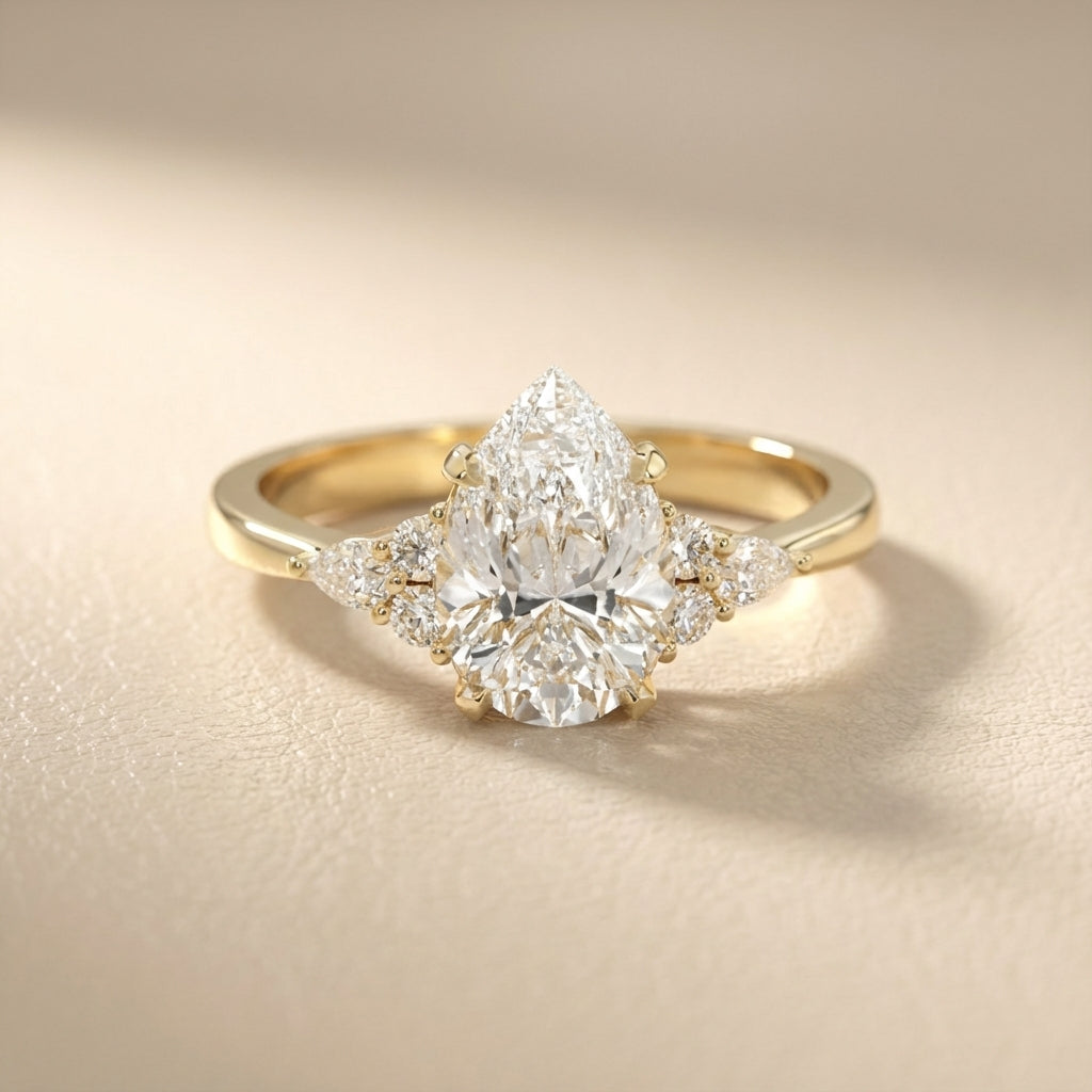 Pear Cut Lab Grown Diamond Three Stone Engagement Ring in Yellow Gold