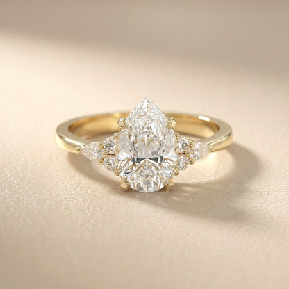 Pear Cut Lab Grown Diamond Three Stone Engagement Ring in Yellow Gold