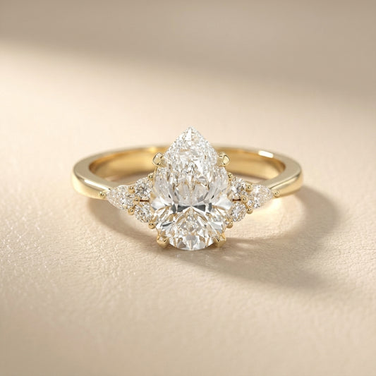 Pear Cut Lab Grown Diamond Three Stone Engagement Ring in Yellow Gold