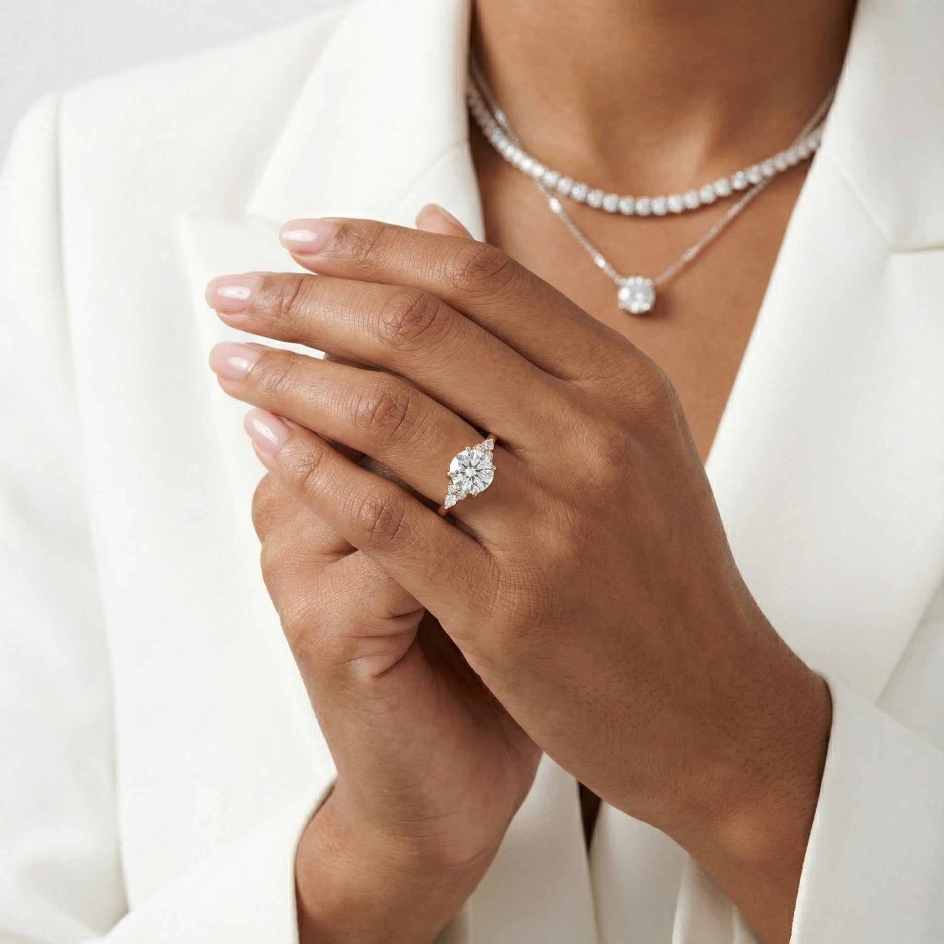 Round Cut Lab Grown Diamond Three Stone Engagement Ring in Rose Gold