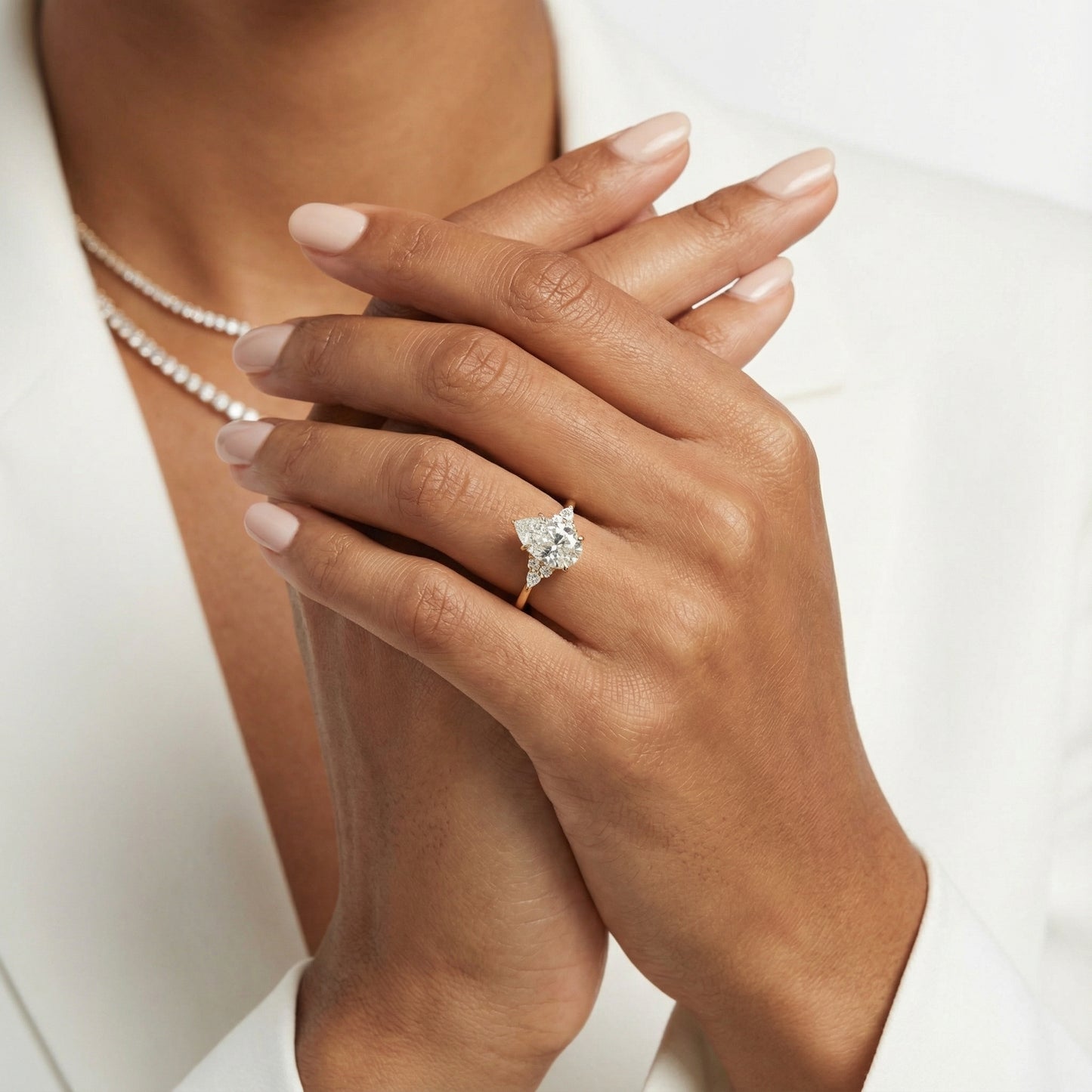 Pear Cut Lab Grown Diamond Three Stone Engagement Ring in Yellow Gold