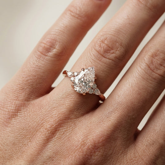 Pear Cut Lab Grown Diamond Three Stone Engagement Ring in Rose Gold