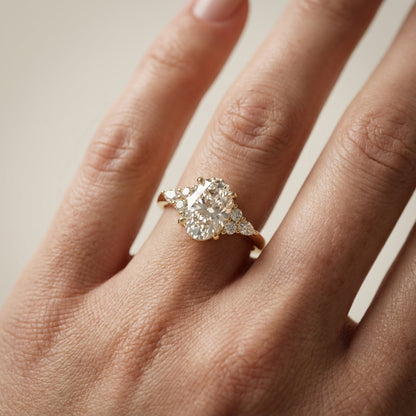 Oval Cut Lab Grown Diamond Three Stone Engagement Ring in Yellow Gold