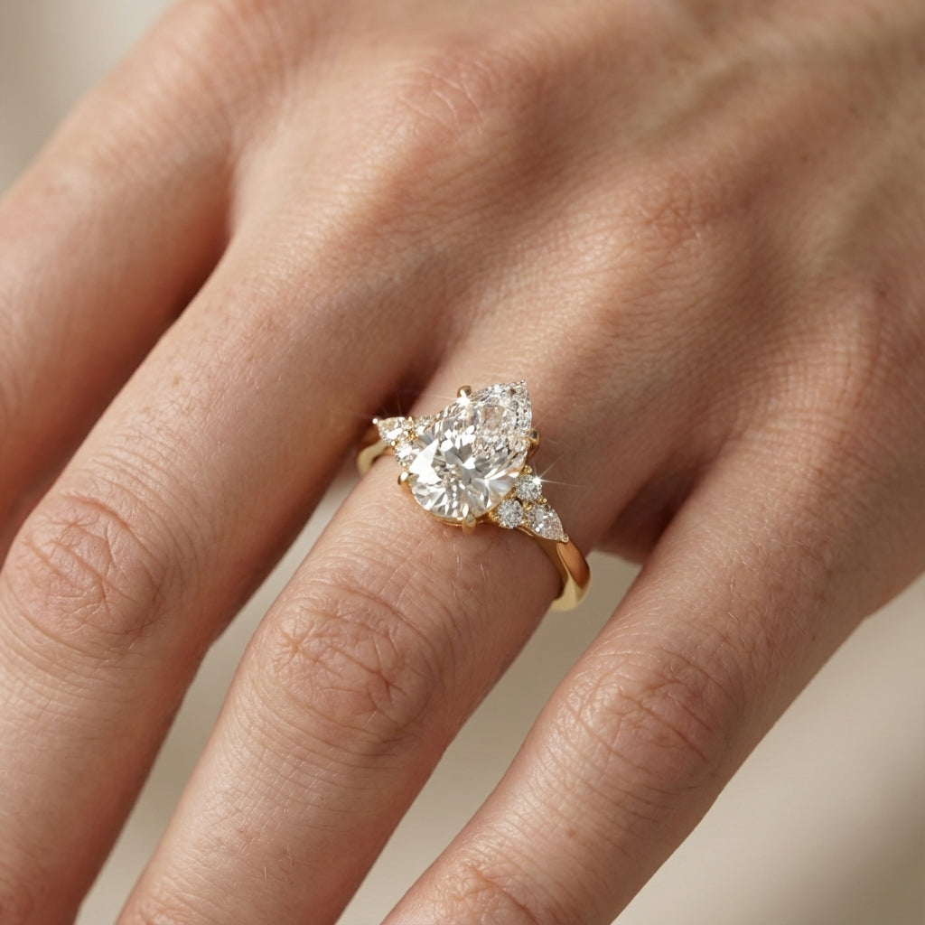 Pear Cut Lab Grown Diamond Three Stone Engagement Ring in Yellow Gold