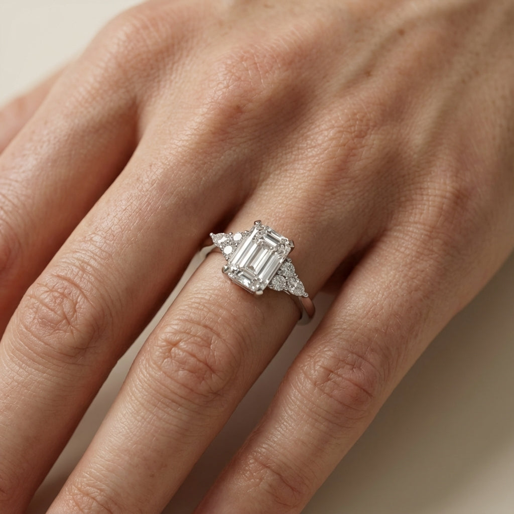 Emerald Cut Lab Grown Diamond Engagement Ring with side stone clusters set in White Gold