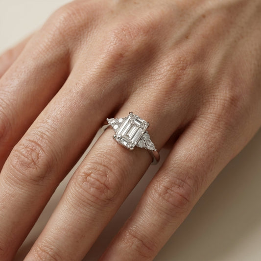 Emerald Cut Lab Grown Diamond Engagement Ring with side stone clusters set in White Gold