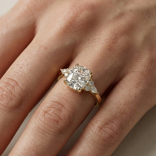 Cushion Cut Lab Grown Diamond Three Stone Engagement Ring in Yellow Gold