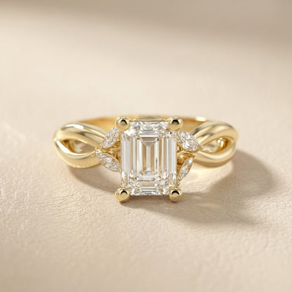 Emerald Cut Lab Grown Diamond Twisted Engagement Ring in Yellow Gold with Marquise Side Stones