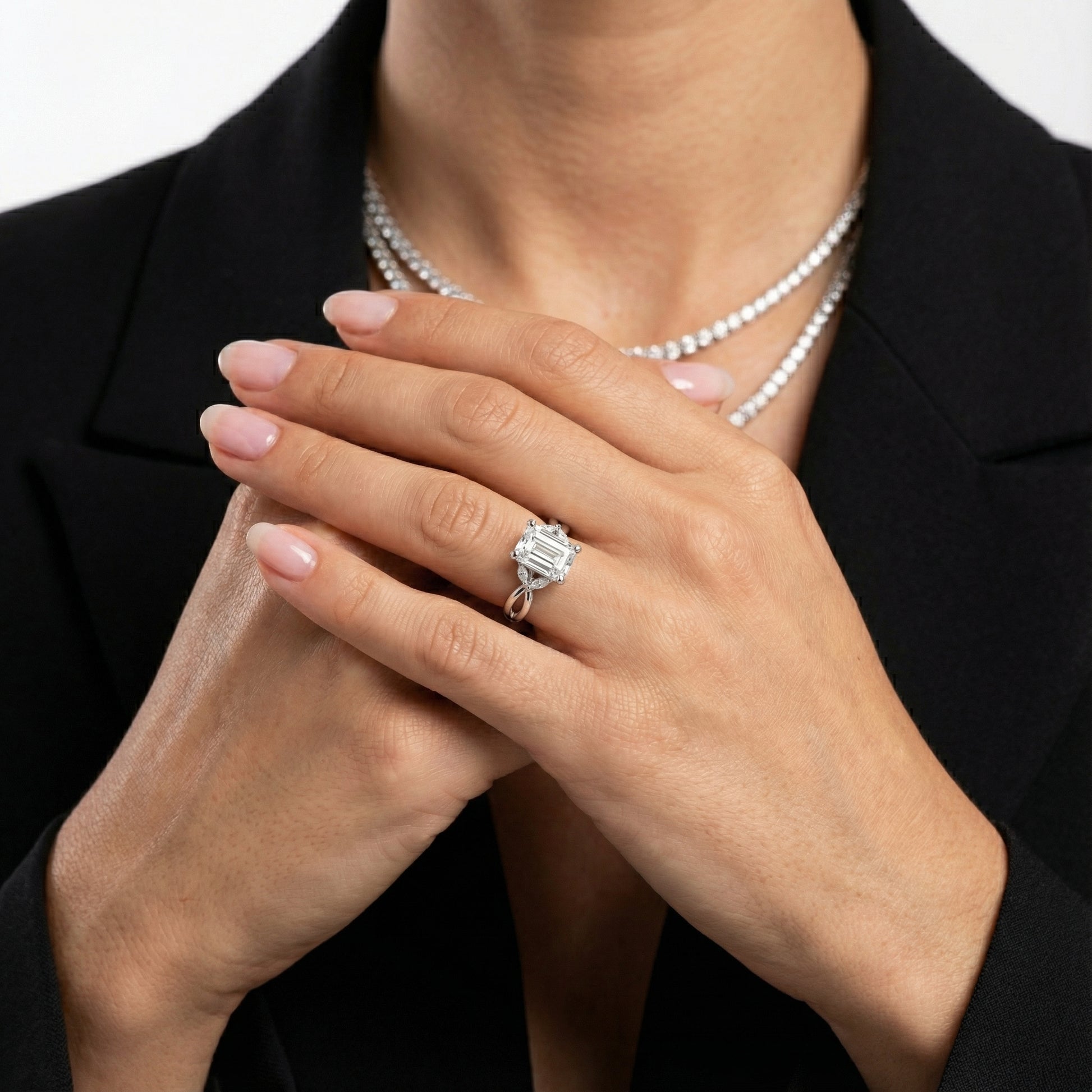 Emerald Cut Lab Grown Diamond Twisted Engagement Ring in Platinum with Marquise Side Stones