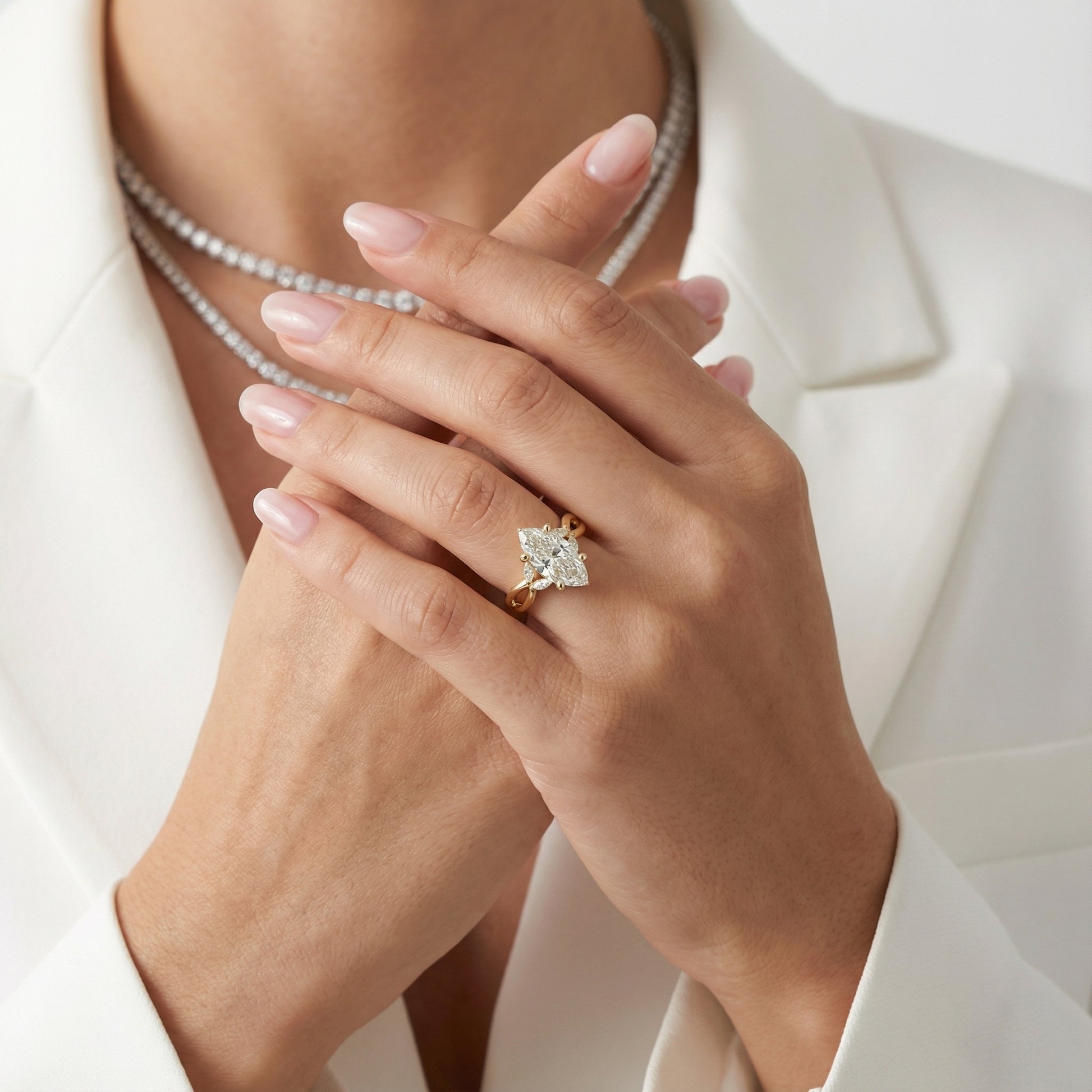 Marquise Cut Lab Grown Diamond Twisted Engagement Ring in Yellow Gold with side stones