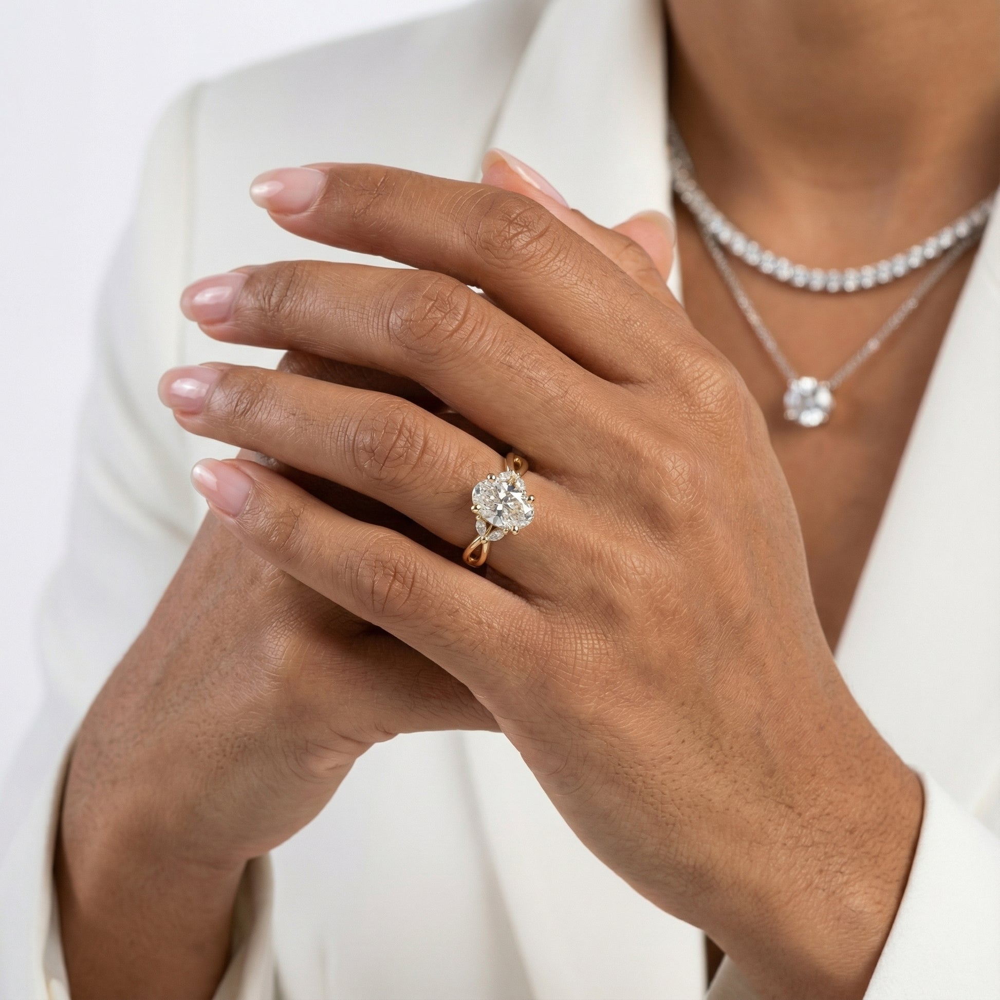 Oval Cut Lab Grown Diamond Twisted Engagement Ring in Yellow Gold