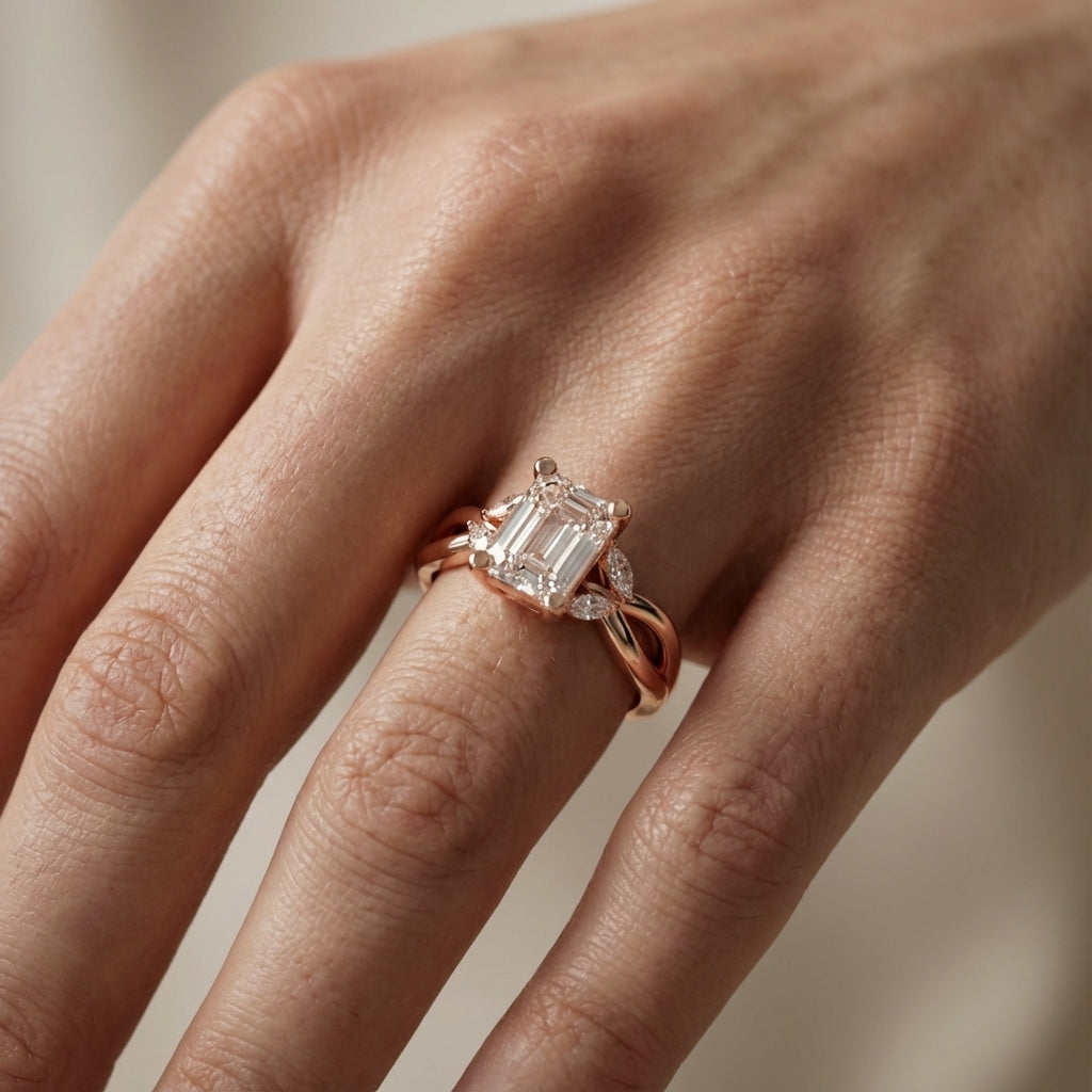 Emerald Cut Lab Grown Diamond Twisted Engagement Ring in Rose Gold with Marquise Side Stones