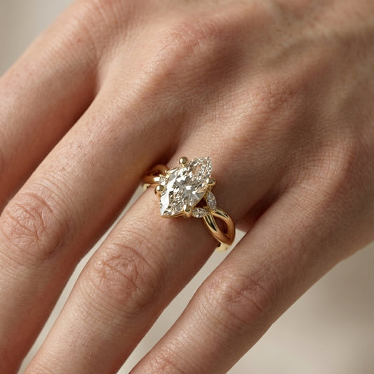 Marquise Cut Lab Grown Diamond Twisted Engagement Ring in Yellow Gold with side stones