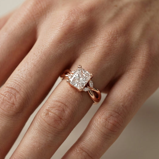 Radiant Cut Lab Grown Diamond Engagement Ring with Marquise Side Stones in Rose Gold with Twisted Band
