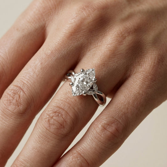 Marquise Cut Lab Grown Diamond Twisted Engagement Ring in Platinum showing side stones