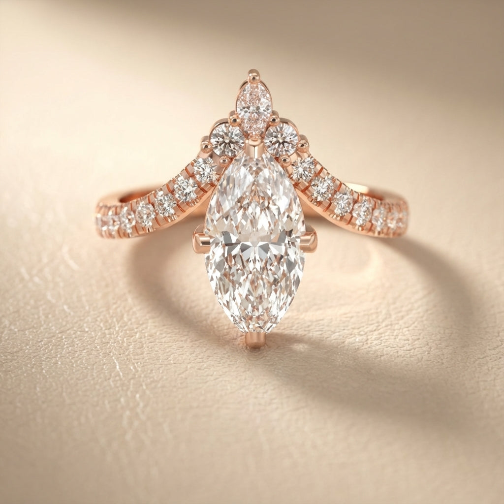 Rose gold engagement ring featuring a marquise cut lab grown diamond and intricate side stone details.