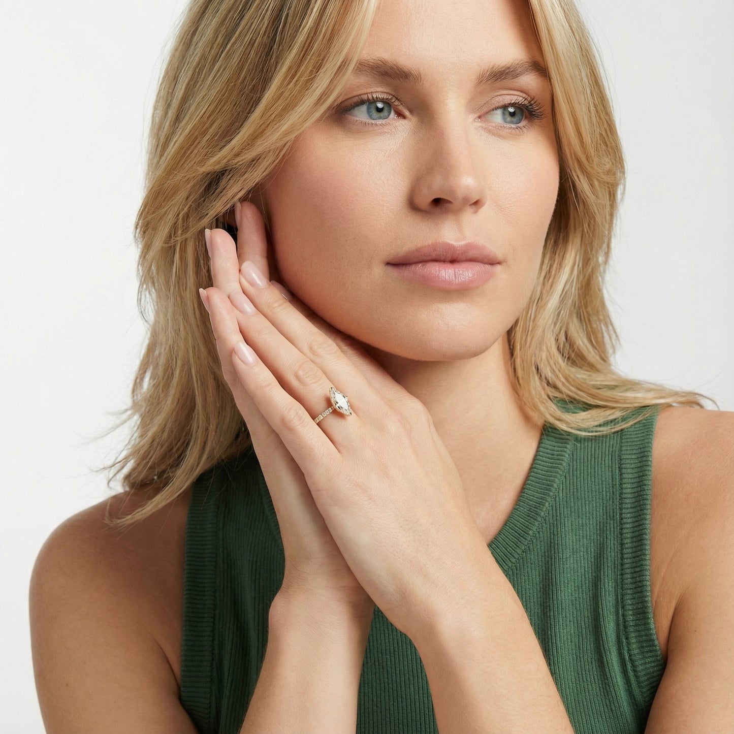 Traditional yellow gold engagement ring with a marquise cut lab grown diamond and side stone detailing.