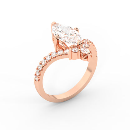 Rose gold engagement ring featuring a marquise cut lab grown diamond and intricate side stone details.