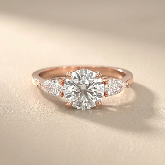 Round cut lab grown diamond three stone engagement ring in rose gold setting