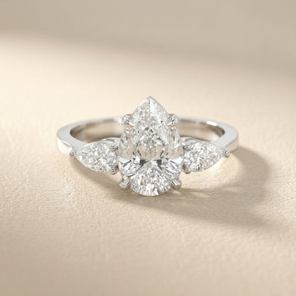 Pear Cut Lab Grown Diamond Three Stone Engagement Ring in White Gold