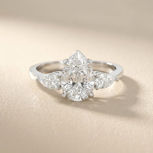Pear Cut Lab Grown Diamond Three Stone Engagement Ring in White Gold