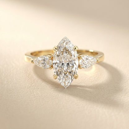 Grace Three Stone Marquise Cut Lab Grown Diamond Engagement Ring in Yellow Gold