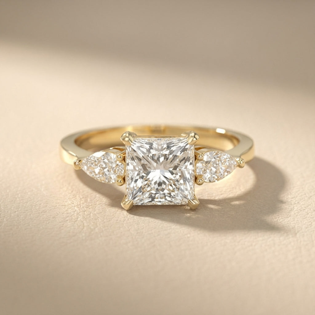 Princess Cut Lab Grown Diamond Three Stone Engagement Ring in Yellow Gold with pear side stones