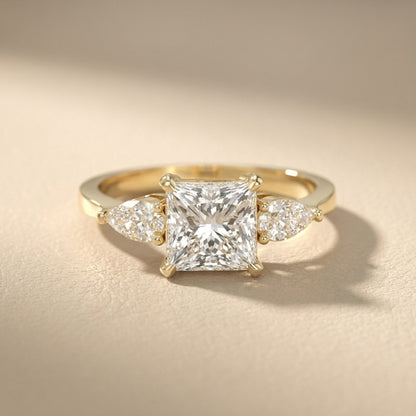 Princess Cut Lab Grown Diamond Three Stone Engagement Ring in Yellow Gold with pear side stones