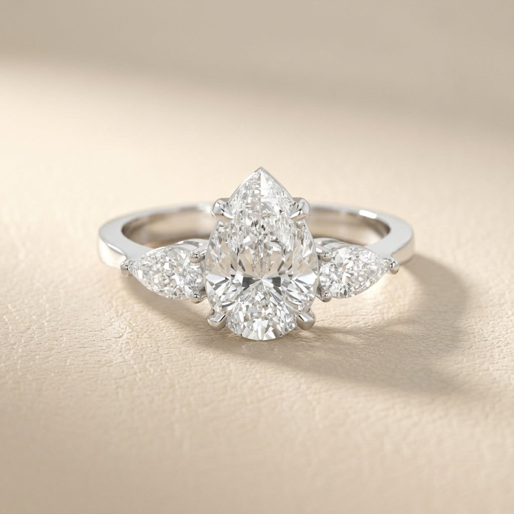 Pear Cut Lab Grown Diamond Three Stone Engagement Ring in Silver