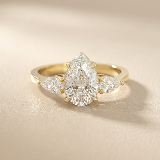 Pear Cut Lab Grown Diamond Three Stone Engagement Ring in Yellow Gold