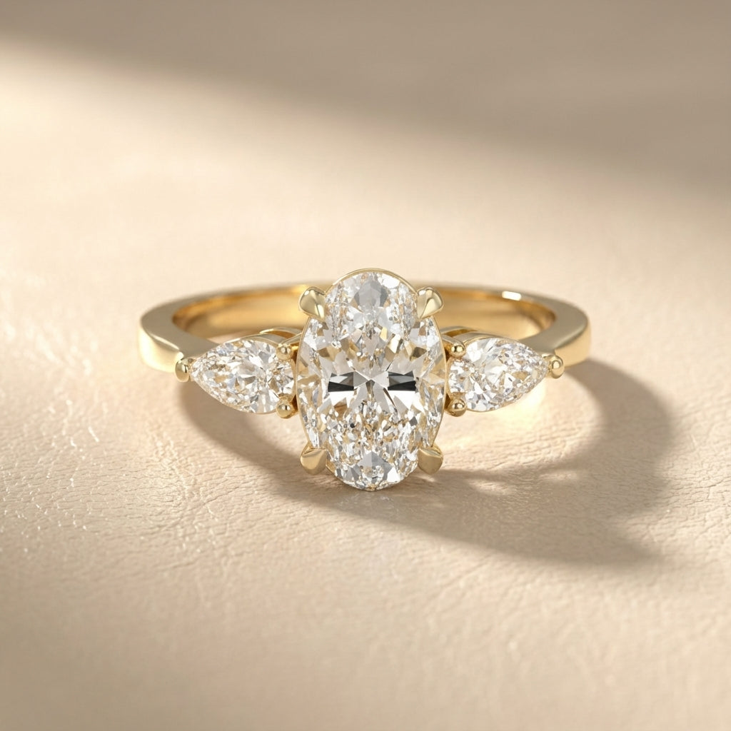 Oval Cut Lab Grown Diamond Three Stone Engagement Ring in Yellow Gold