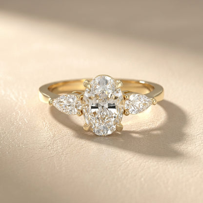Oval Cut Lab Grown Diamond Three Stone Engagement Ring in Yellow Gold