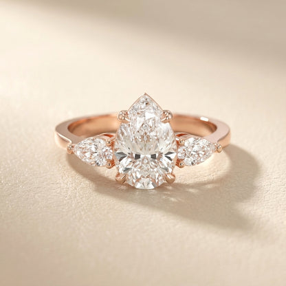 Pear Cut Lab Grown Diamond Three Stone Engagement Ring in Rose Gold