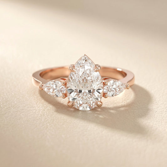 Pear Cut Lab Grown Diamond Three Stone Engagement Ring in Rose Gold