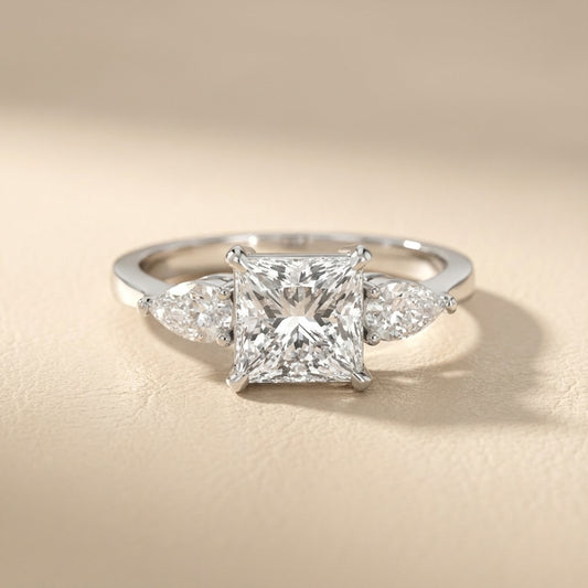 Princess Cut Lab Grown Diamond Three Stone Engagement Ring in Platinum with pear side stones