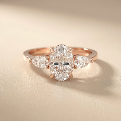 Oval Cut Lab Grown Diamond Three Stone Engagement Ring in Rose Gold setting