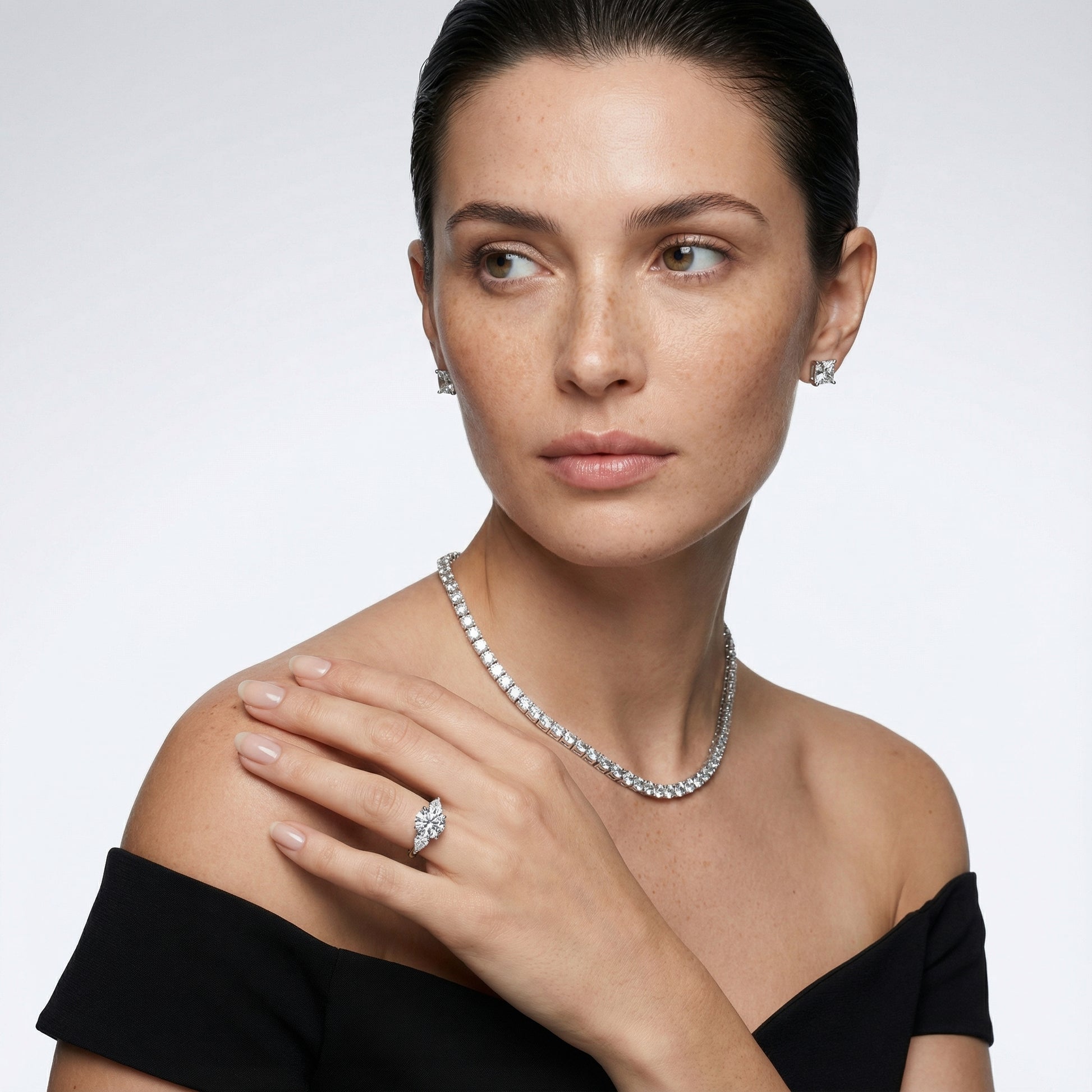 Round cut lab grown diamond three stone engagement ring in white gold setting