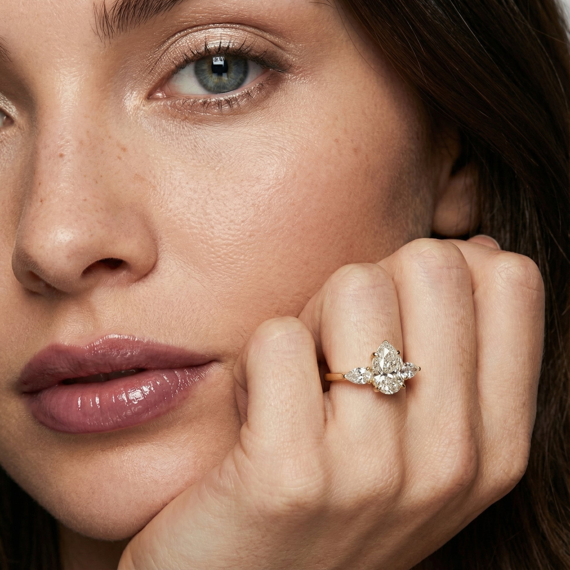 Pear Cut Lab Grown Diamond Three Stone Engagement Ring in Yellow Gold