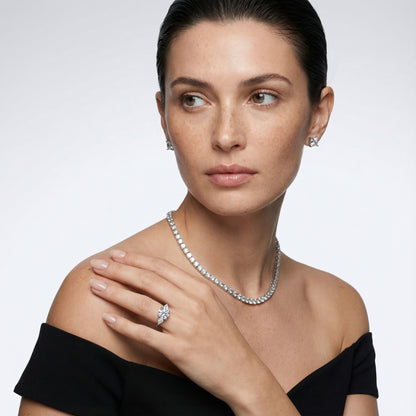 Round cut lab grown diamond three stone engagement ring in platinum setting