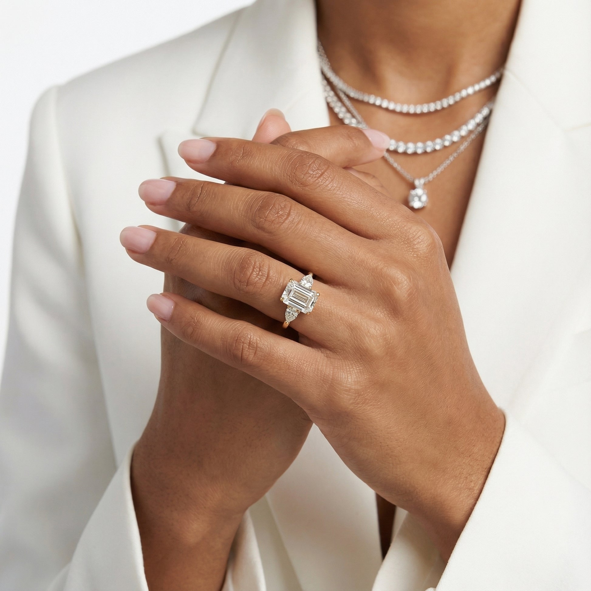 Grace Three Stone Emerald Cut Lab Grown Diamond Engagement Ring set in Yellow Gold