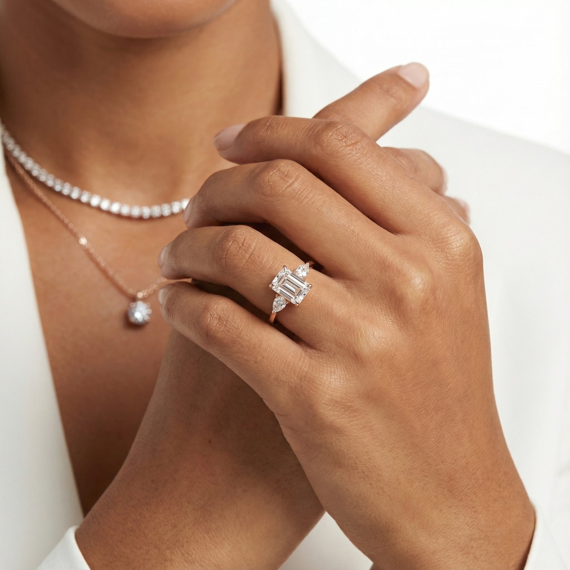 Grace Three Stone Emerald Cut Lab Grown Diamond Engagement Ring set in Rose Gold