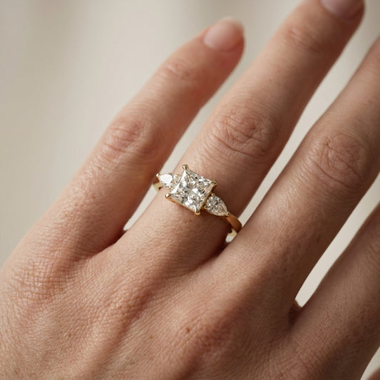 Princess Cut Lab Grown Diamond Three Stone Engagement Ring in Yellow Gold with pear side stones