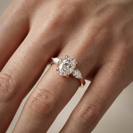 Oval Cut Lab Grown Diamond Three Stone Engagement Ring in Rose Gold setting
