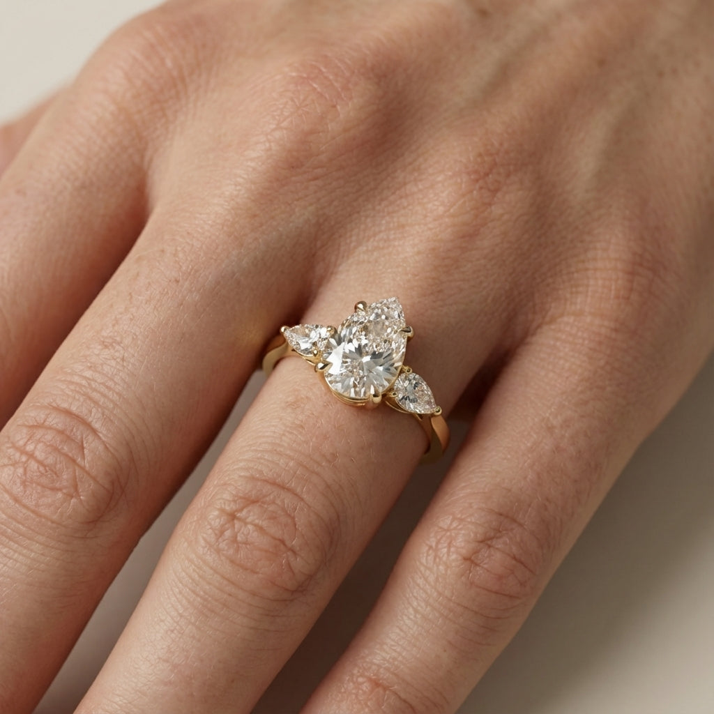 Pear Cut Lab Grown Diamond Three Stone Engagement Ring in Yellow Gold