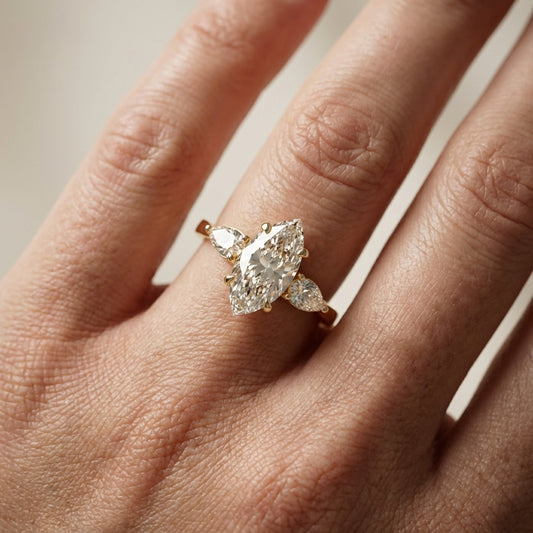 Grace Three Stone Marquise Cut Lab Grown Diamond Engagement Ring in Yellow Gold