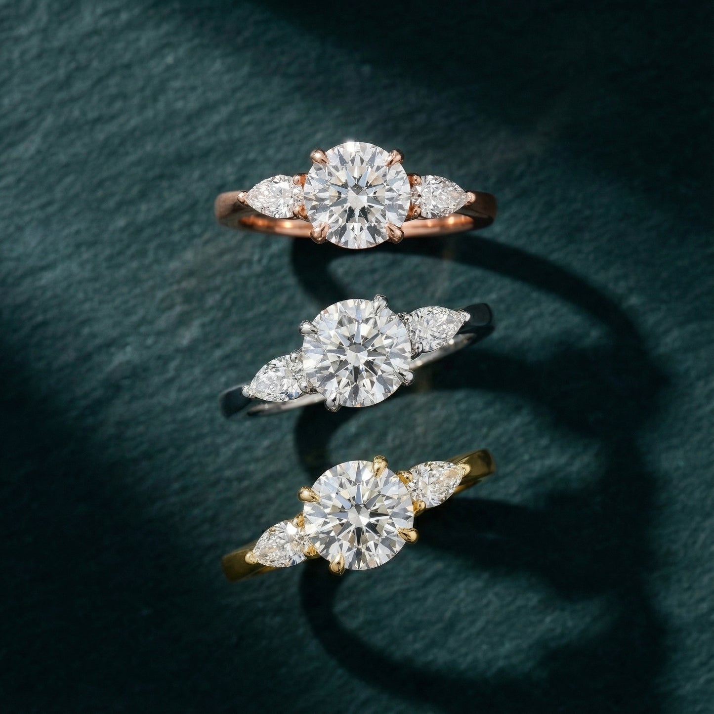 Round cut lab grown diamond three stone engagement ring in rose gold setting